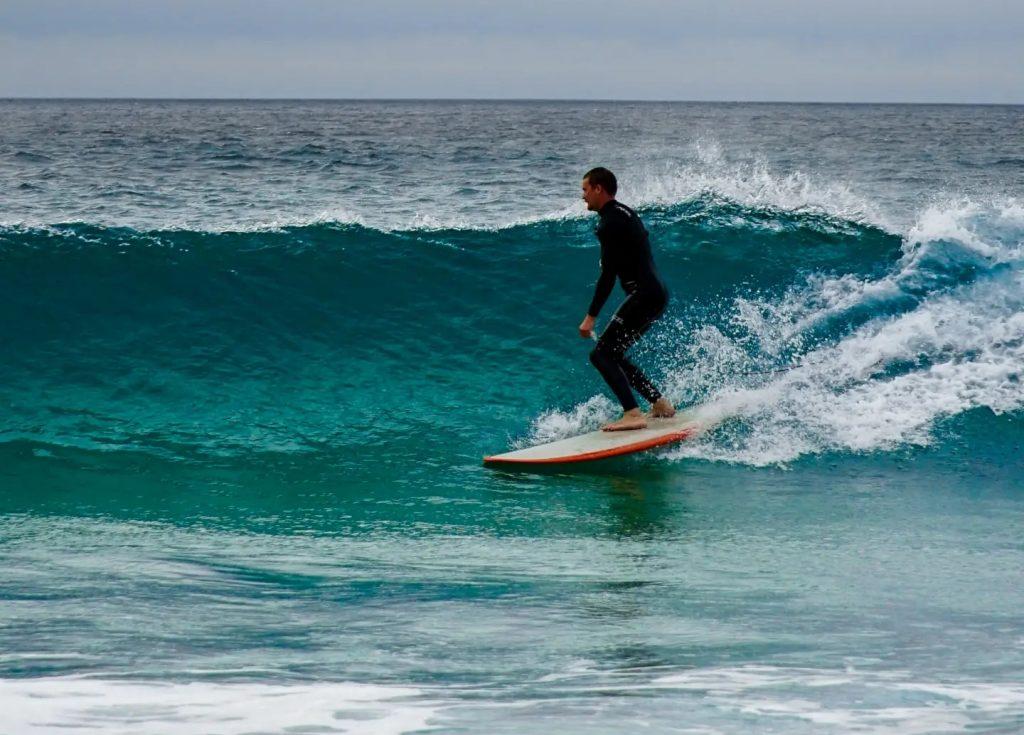 surfing an Newquay Fistral beach in Cornwall