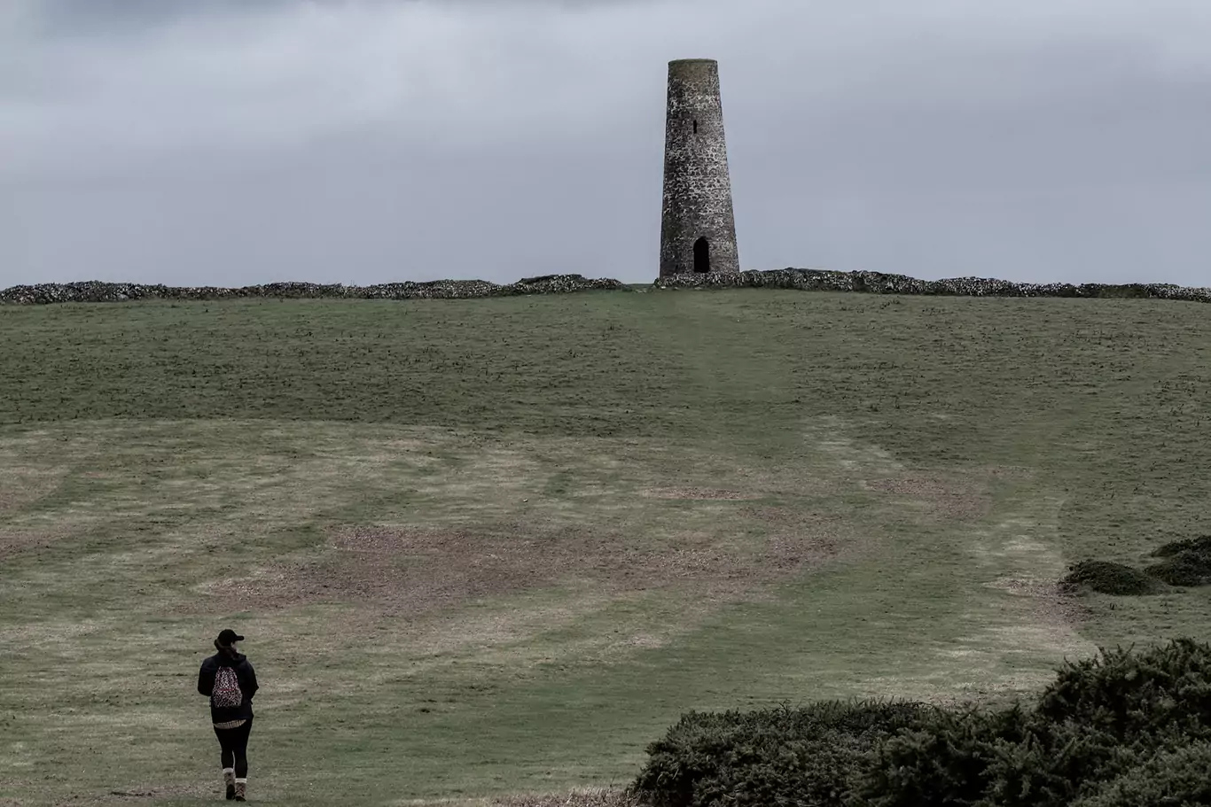 A woman walking to a haunted Cornwall mine