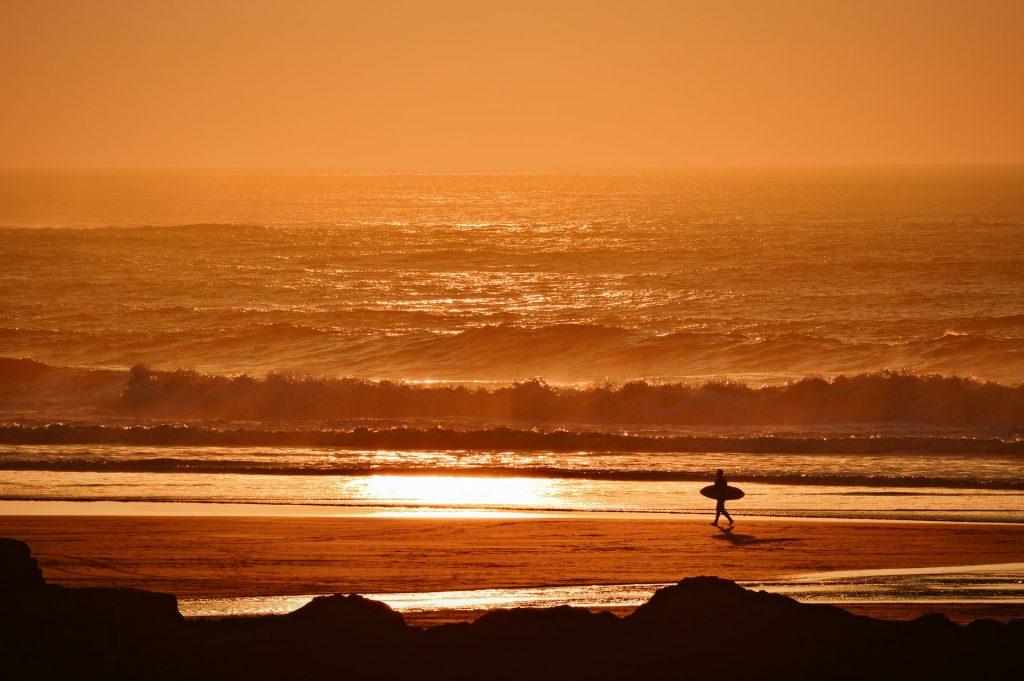 Surfing at sunset at Perranporth