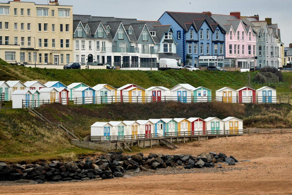 bude town with beach huts in the foreground